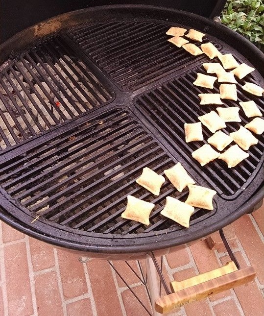 Grilling pizza rolls on a weber