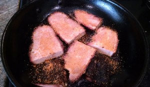 unpulled pork steaks in a pan