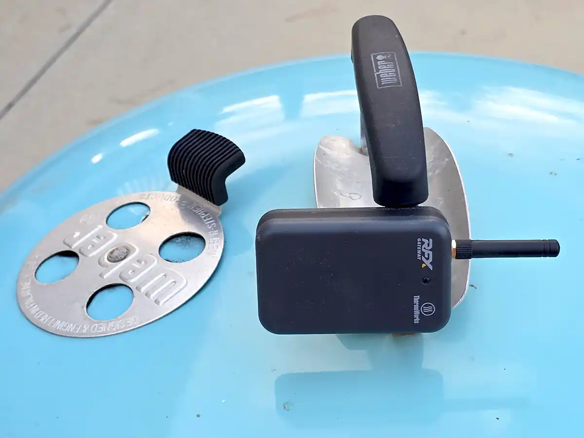 RFX Gateway wireless bbq thermometer attached to the bolt-on lid of a 26 inch Weber charcoal grill